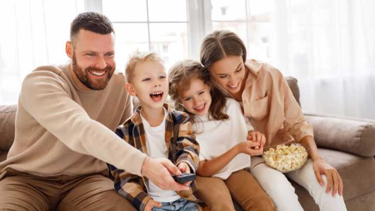 Family enjoying movie time together.