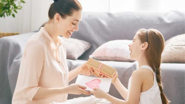 Mom and daughter exchanging thoughtful gifts for each other.