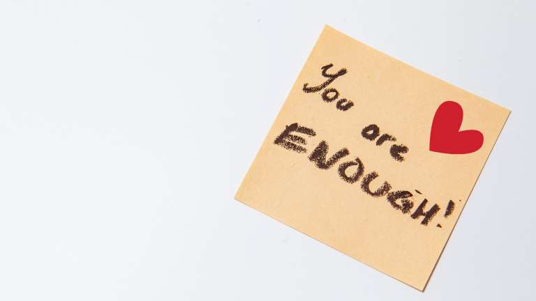 Sticky note saying you are enough.