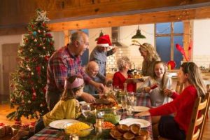 Family gathering in a warm Christmas dinner.